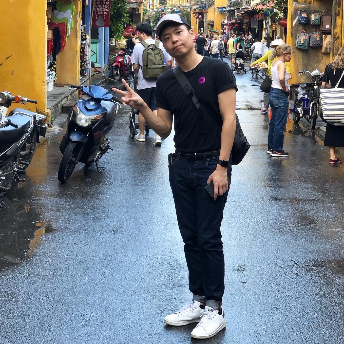 TJ posing with a "V" sign on vacation in Vietnam